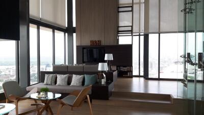 Modern high-rise living room with large windows and city view