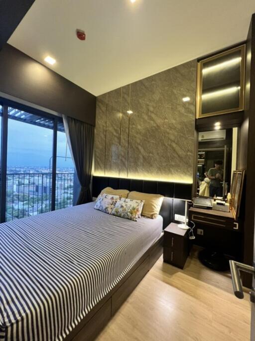 Modern bedroom with large bed and bedside table