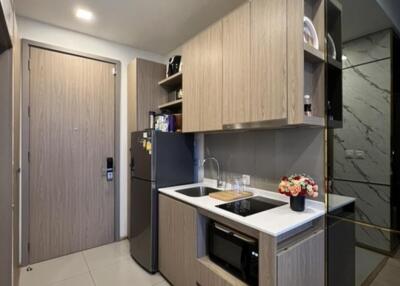 Modern kitchen with wooden cabinets and stainless steel appliances