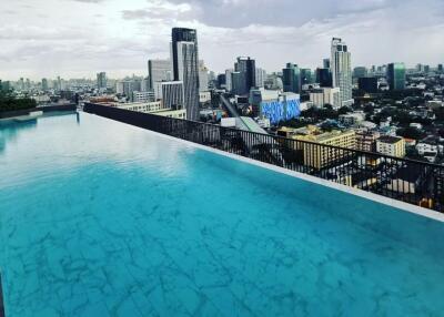 Rooftop infinity pool with city skyline view