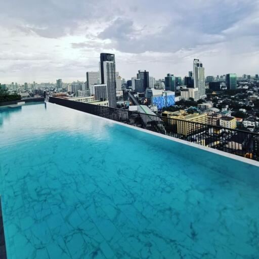 Rooftop infinity pool with city skyline view