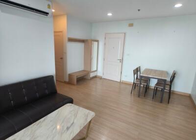 Modern living room with dining area and air conditioning