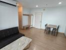 Modern living room with dining area and air conditioning