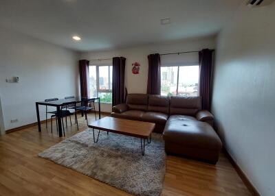 Spacious living room with modern furniture and large windows