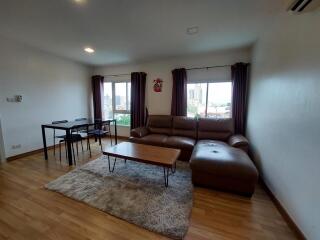 Spacious living room with modern furniture and large windows