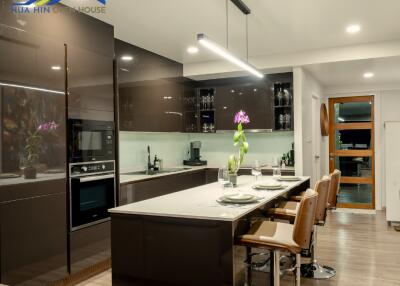 Modern kitchen with island and seating area