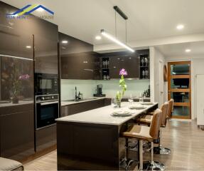 Modern kitchen with island and seating area