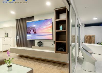 Modern living room with wall-mounted TV and contemporary decor