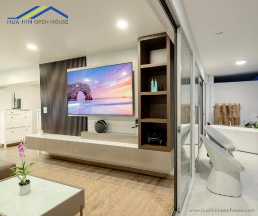 Modern living room with wall-mounted TV and contemporary decor