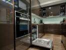 Modern kitchen with built-in appliances and open dishwasher