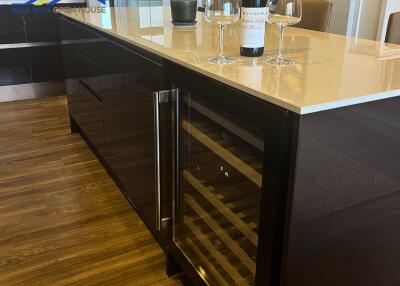 Modern kitchen island with wine fridge