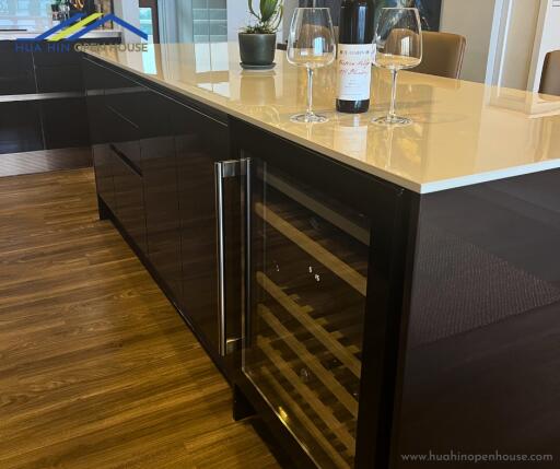 Modern kitchen island with wine fridge