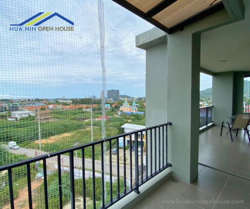 Balcony with a view of the surrounding area and distant buildings