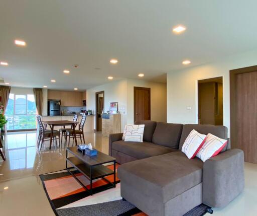 Spacious open-plan living room with modern kitchen