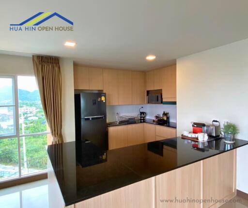 Modern kitchen with black countertop