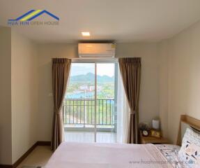 Bedroom with a balcony view