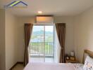 Bedroom with a balcony view