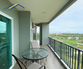 Spacious balcony with outdoor seating and scenic view