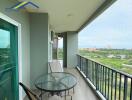 Spacious balcony with outdoor seating and scenic view