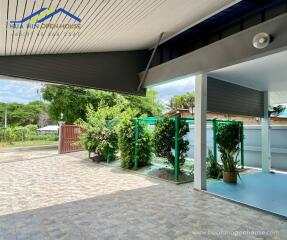 Outdoor view with garden and covered area