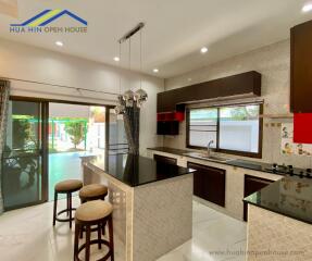 Modern kitchen with island and pendant lights