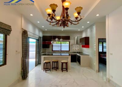 Modern kitchen with island and bar stools