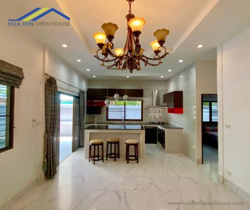 Modern kitchen with island and bar stools