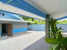 Outdoor view of a house with covered area and garden space