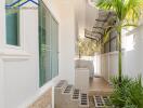 Outdoor space with plants and a small tiled patio