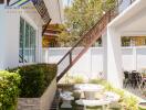 Outdoor seating area with stairs and garden