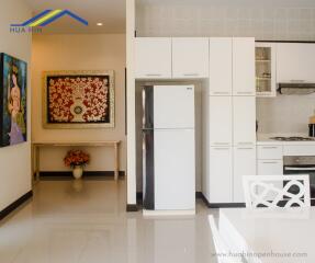 Modern kitchen with artwork and dining area