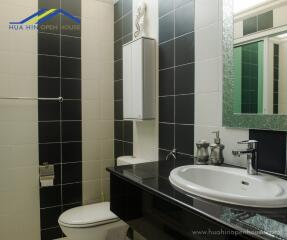 Modern bathroom with black and white tiles