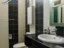 Modern bathroom with black and white tiles