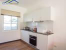 Modern kitchen with white cabinets and appliances