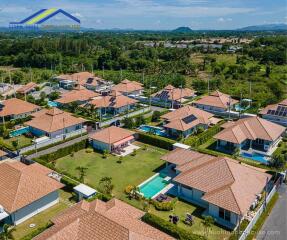 Aerial view of a residential neighborhood with houses and green lawns