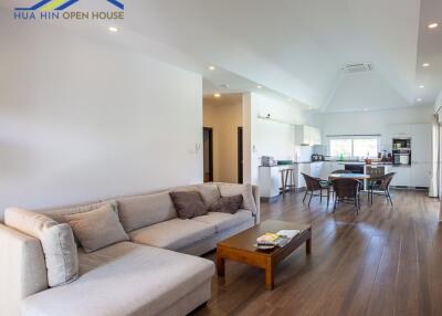 Spacious living room and kitchen area with modern furnishings