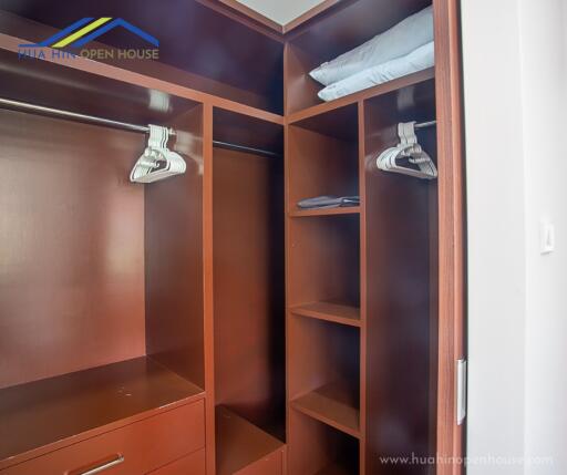 Spacious walk-in closet with shelves and hanging space