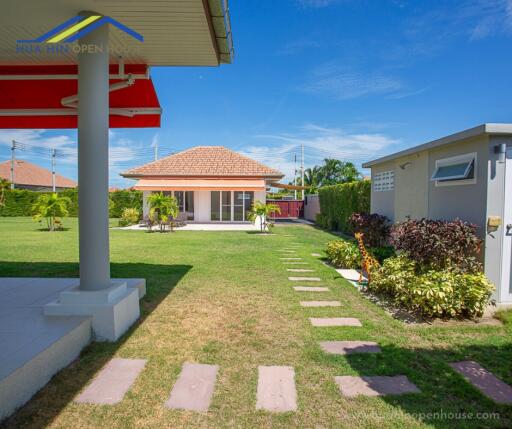 House with garden and outdoor pathway