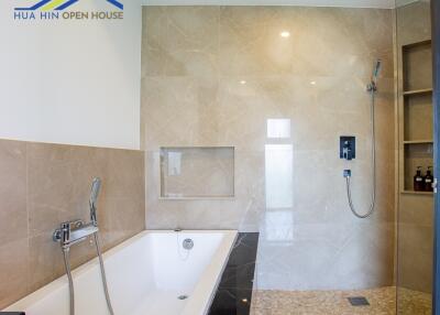 Modern bathroom with a bathtub and walk-in shower