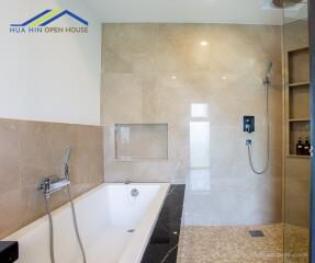 Modern bathroom with a bathtub and walk-in shower