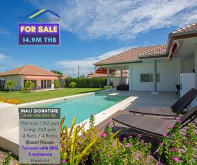 Beautiful outdoor pool area with sun loungers and terrace