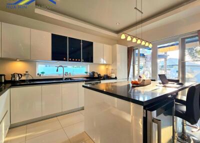 Modern kitchen with island and large windows