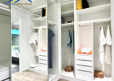 Spacious and modern bedroom closet with organized wardrobe