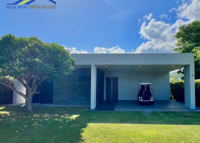 Modern building with carport and golf cart