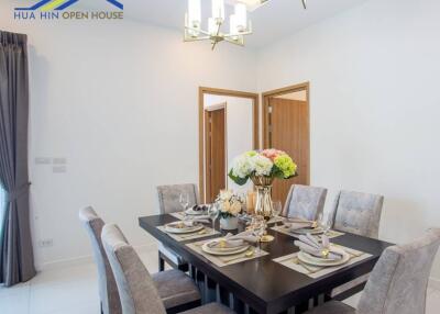 Dining room with a set table and modern decor