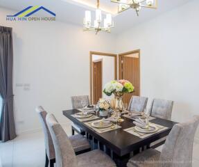 Dining room with a set table and modern decor