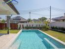 Beautiful outdoor swimming pool with clear water and surrounding greenery