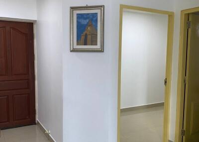 Hallway with doorways and painting