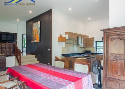 Spacious dining area with adjoining modern kitchen