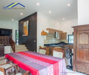 Spacious dining area with adjoining modern kitchen